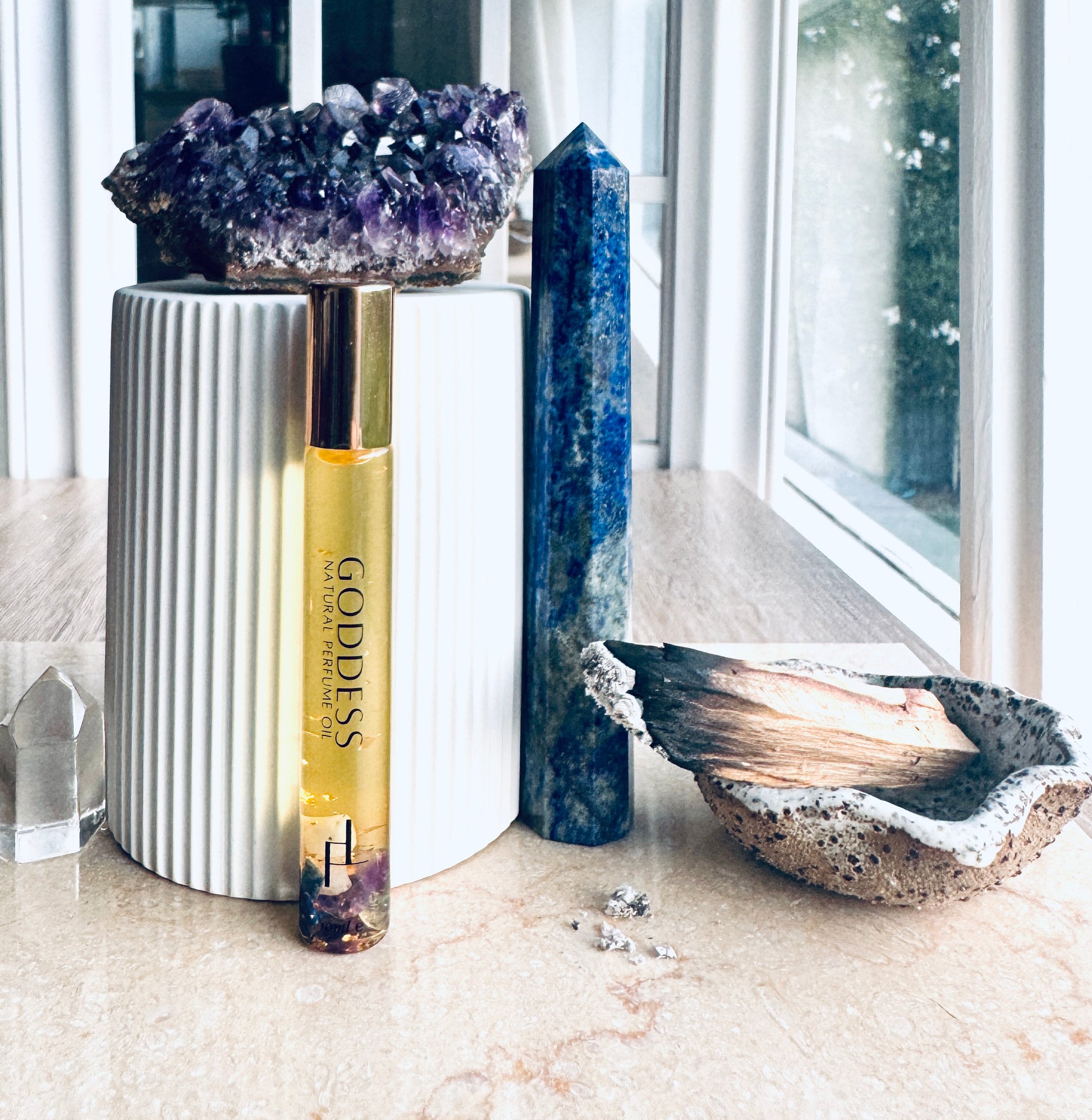 rituals, natural perfume, crystals, goddess, lapis lazuli, palo Santo cleanse, amethyst, studio vibes, golden hue